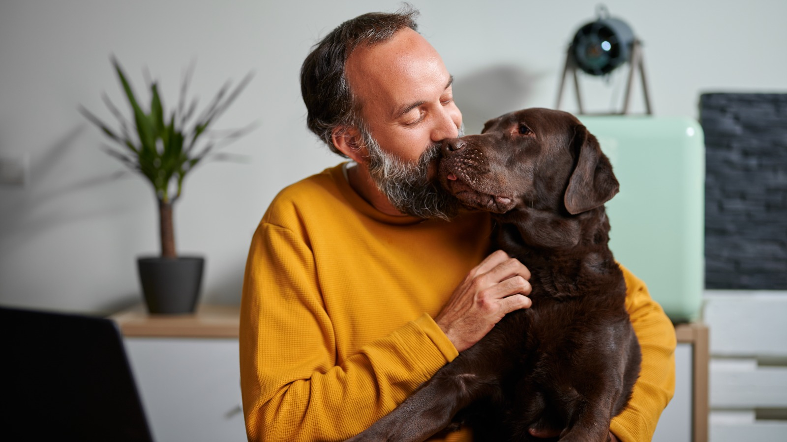Man kissing on his dog Man with his dog